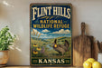 A vintage-style sign for the Flint Hills National Wildlife Refuge in Kansas, featuring a turkey in a field with flowers and a river in the background.