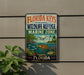 A vintage-style metal sign for the Florida Keys National Wildlife Refuge, featuring an illustration of a turtle, fish, and other marine life, along with the text "FLORIDA KEYS NATIONAL WILDLIFE REFUGE MARINE ZONE" and "FLORIDA" at the bottom.