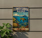 A vintage-style sign for the Flower Garden Banks National Marine Sanctuary in Texas, featuring a colorful illustration of marine life and coral.
