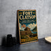 A vintage-style metal sign for Fort Clatsop Lewis and Clark National Historical Park in Oregon, featuring an illustration of a wooden fort and a river.