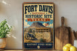 A vintage-style sign for Fort Davis National Historic Site in Texas, featuring a cannon and a building, is displayed on a shelf next to a potted plant and a wooden cutting board.