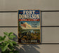 A vintage-style metal sign for Fort Donelson, Tennessee, featuring an American flag and a cannon, mounted on a wall.