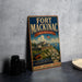 A vintage-style metal sign for Fort Mackinac, Michigan, featuring an illustration of the fort and surrounding landscape.