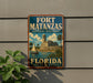 A vintage-style sign for Fort Matanzas National Monument in Florida, featuring a castle, palm trees, and a sailboat.