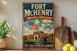 A vintage-style sign for the Fort Mchenry National Monument in Baltimore, Maryland, featuring an American flag and a building with a cannon.