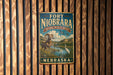 A vintage-style metal sign for Fort Niobrara National Wildlife Refuge in Nebraska, featuring an illustration of a ram and a bird in a natural setting.