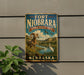 A vintage-style sign for the Fort Niobrara National Wildlife Refuge in Nebraska, featuring a large rams and a white heron in a scenic landscape.