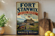 a vintage-style sign for the Fort Stanwix National Monument in New York, with a wooden board and a potted plant in the foreground.