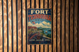 A vintage metal sign for Fort Ticonderoga, New York, featuring a scenic illustration of the fort and surrounding landscape.