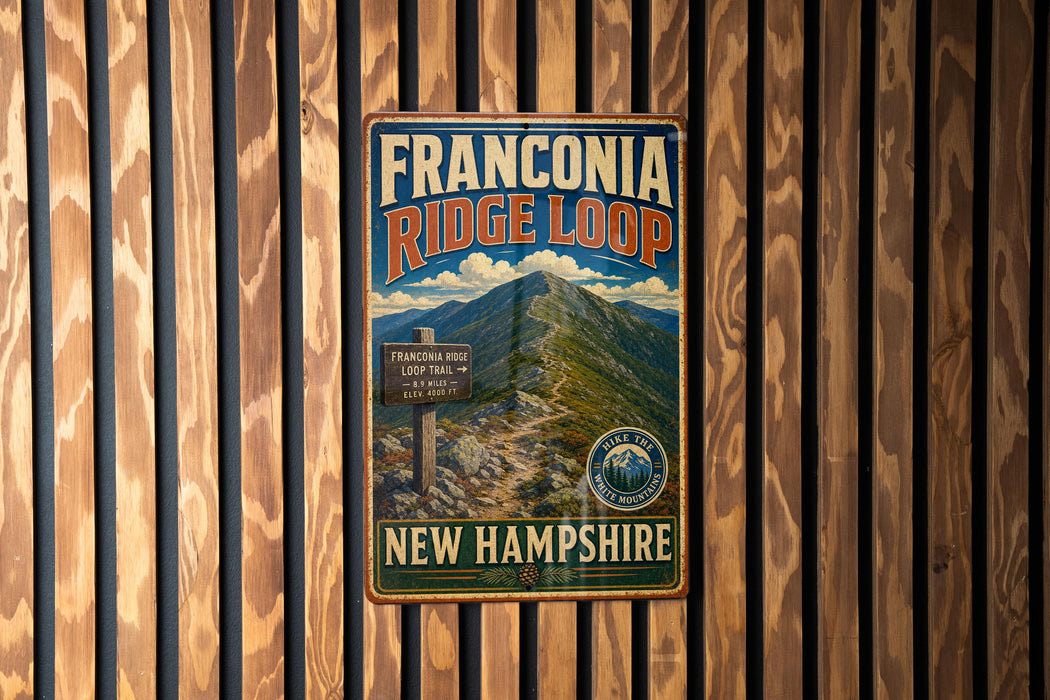 A vintage metal sign for the Franconia Ridge Loop trail in New Hampshire, featuring a mountain landscape and trail information.