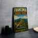 A vintage trail sign for the Franconia Ridge Trail in Massachusetts, featuring a scenic mountain landscape.