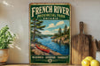 A vintage-style sign for French River Provincial Park, Ontario, featuring a canoe on a river surrounded by pine trees and mountains.