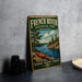 A vintage-style metal sign for French River Provincial Park, Ontario, featuring a canoe on a lake surrounded by trees and mountains.