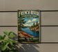 A vintage-style metal sign for French River Provincial Park, Ontario, featuring a canoe on a river surrounded by pine trees and mountains.