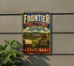 A vintage metal sign for the Frontier Culture Museum in Virginia, featuring an illustration of a wagon and a sign that says "Frontier Culture Museum Virginia".