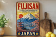 a vintage-style sign for Fujisan, a Japanese company, with a mountain landscape and a temple in the background. The sign is displayed on a shelf next to a wooden cutting board and some potted plants.