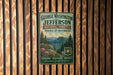 A vintage-style metal sign for George Washington and Jefferson National Forests in Virginia and West Virginia, featuring a scenic mountain landscape with pine trees and flowers.