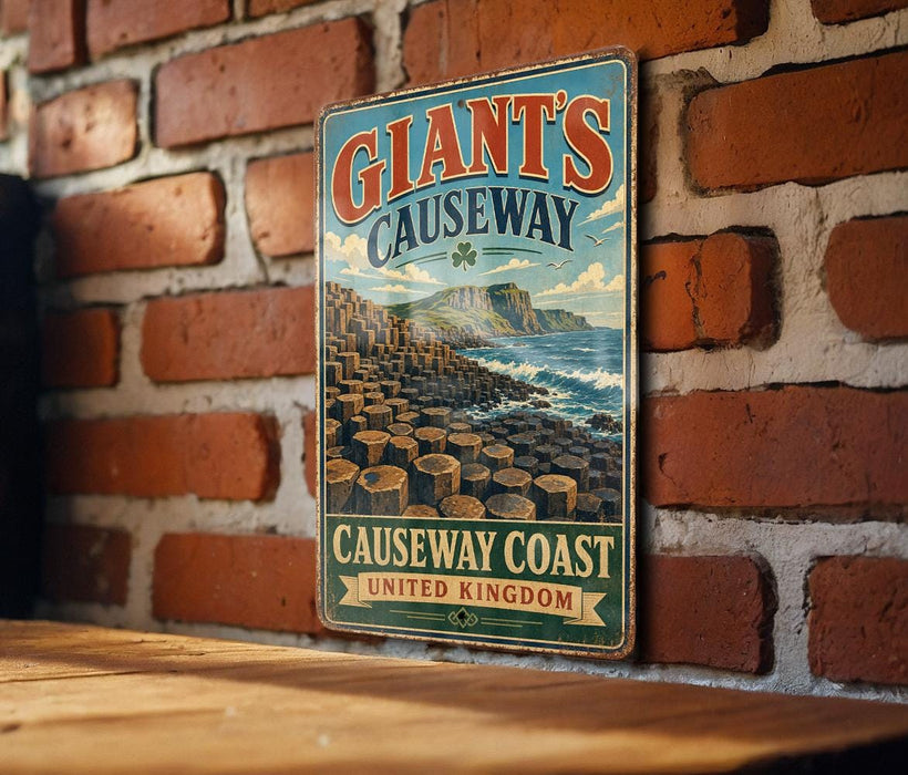 A vintage-style metal sign for Giant's Causeway, a famous tourist attraction in the United Kingdom, is displayed on a brick wall.
