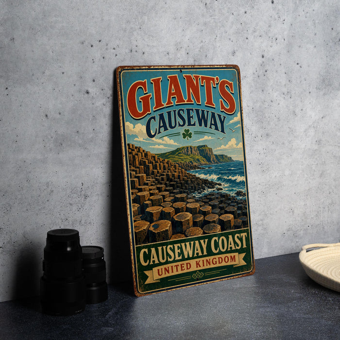 A vintage-style sign for Giant's Causeway, a famous tourist attraction in Northern Ireland, featuring a scenic image of the Causeway coast.