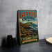 A vintage-style sign for Giant's Causeway, a famous tourist attraction in Northern Ireland, featuring a scenic image of the Causeway coast.