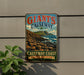 A vintage-style sign for Giant's Causeway, a famous tourist attraction in Northern Ireland, featuring a scenic image of the Causeway coast.