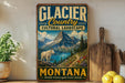 A vintage-style sign for Glacier Country, Montana, featuring a mountain landscape with a goat, is displayed on a shelf next to a wooden cutting board and some lemons.