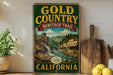 a vintage-style sign for the Gold Country Heritage Trail in California, with a scenic illustration of a river, mountains, and buildings.