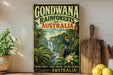 A vintage-style poster advertising the Gondwana Rainforests of Australia, featuring a tropical landscape with a waterfall and various wildlife.
