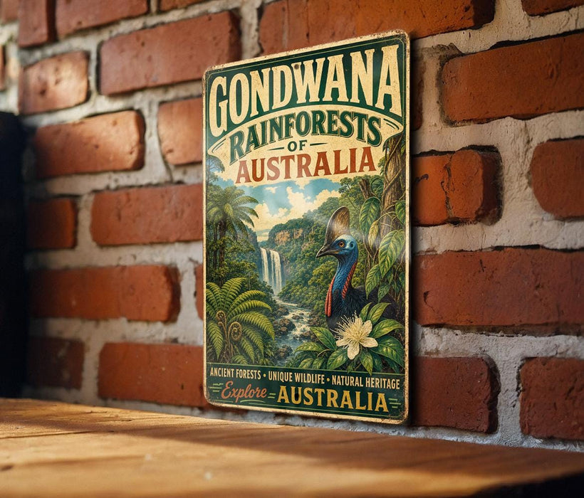 A vintage-style sign for the Gondwana Rainforests of Australia, featuring a tropical landscape with a waterfall and a bird.
