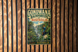 A vintage-style sign for the Gondwana Rainforests of Australia, featuring a tropical landscape with palm trees, a waterfall, and a bird.