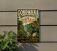 A vintage-style metal sign advertising the Gondwana Rainforests of Australia, featuring a tropical landscape with a waterfall and various wildlife.