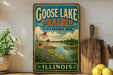 A vintage-style sign for Goose Lake Prairie, Illinois, featuring a scenic landscape with flowers and a lake.