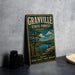 A vintage metal sign for Granville State Forest in Massachusetts, featuring a scenic illustration of a forest and a lake.