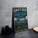 A vintage-style metal sign for the Gray's Reef National Marine Sanctuary in Georgia, featuring an illustration of a turtle swimming among coral and marine life.