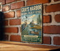 A vintage-style sign for the Grays Harbor National Wildlife Refuge in Washington, featuring an illustration of birds and a serene landscape.