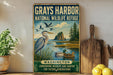 A vintage-style metal sign for the Grays Harbor National Wildlife Refuge in Washington, featuring an illustration of various birds in a natural setting.