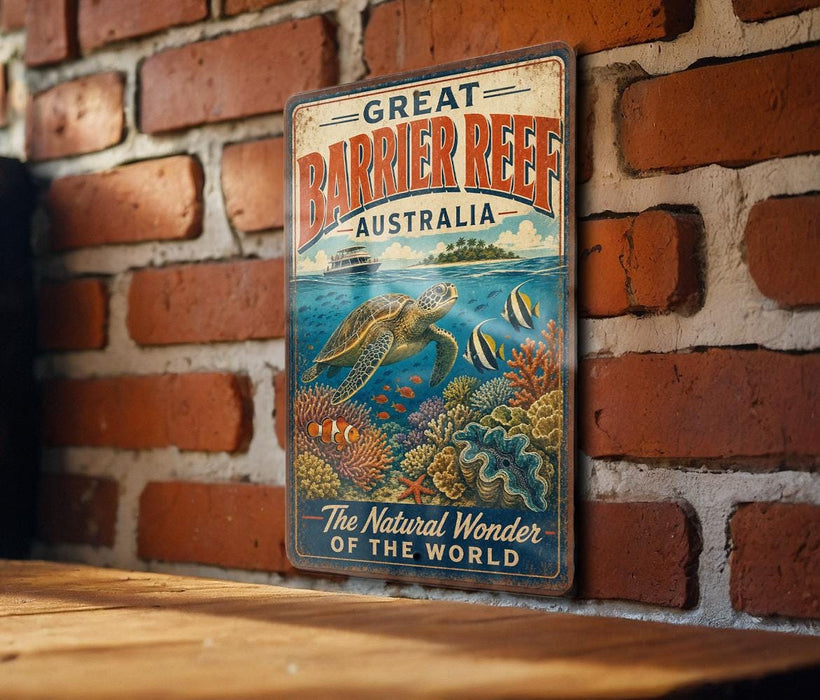 A vintage-style metal sign with the text "GREAT BARRIER REEF AUSTRALIA" and an illustration of a sea turtle swimming among colorful coral and fish.