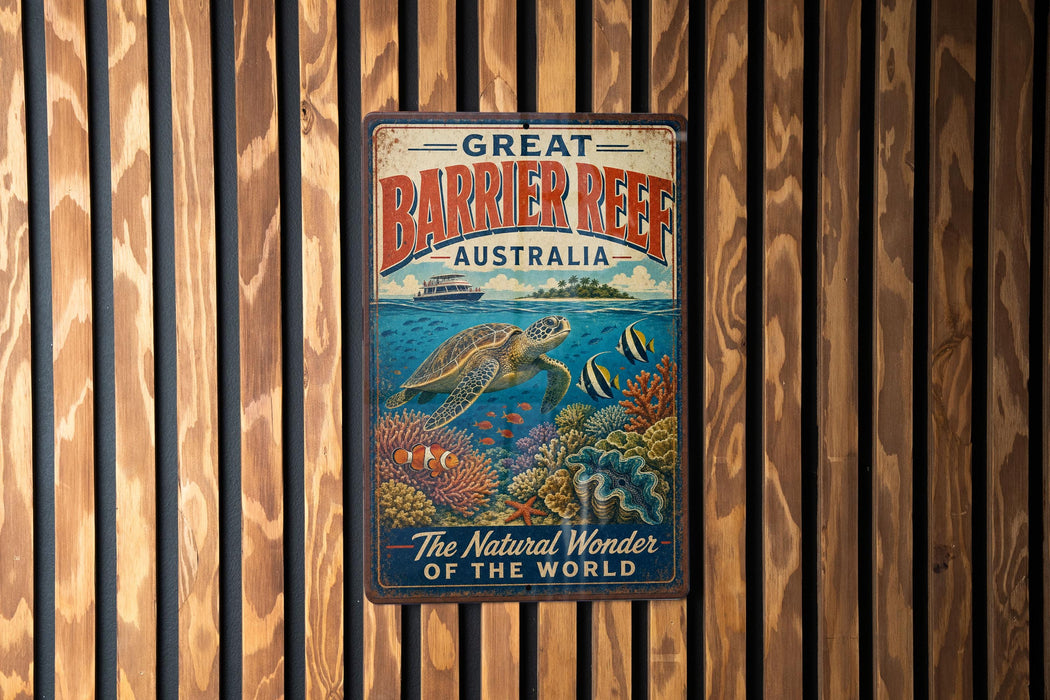 A vintage-style metal sign with the text "GREAT BARRIER REEF AUSTRALIA" and an illustration of a sea turtle swimming among colorful coral and fish.