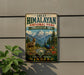 A vintage-style metal sign for the Himalayan National Park, featuring a mountain landscape with a goat and a peacock, mounted on a wall.