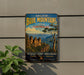 a vintage-style sign for the Blue Mountains area in Australia, with a scenic illustration of the landscape.