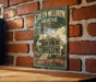 A vintage-style sign for the Green-Meltrim House in Georgia, featuring a large illustration of a historic two-story house with a wrap-around porch and a tower.
