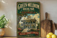 A vintage-style sign for the Green-MELDrim House in Georgia, featuring a large illustration of the historic two-story house with a wrap-around porch and a tower.