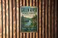 A vintage-style metal sign for the Green River State Forest in Kentucky, featuring a scenic image of the river surrounded by lush forests.