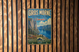 A vintage metal sign for Gros Morne National Park in Canada, featuring a scenic mountain landscape with a lake and pine trees.