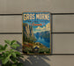 A vintage-style metal sign for Gros Morne National Park in Canada, featuring a scenic landscape with mountains, a lake, and a forest.