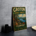 A vintage-style metal sign for Groton State Forest in Vermont, featuring a scenic landscape with a lake and mountains.