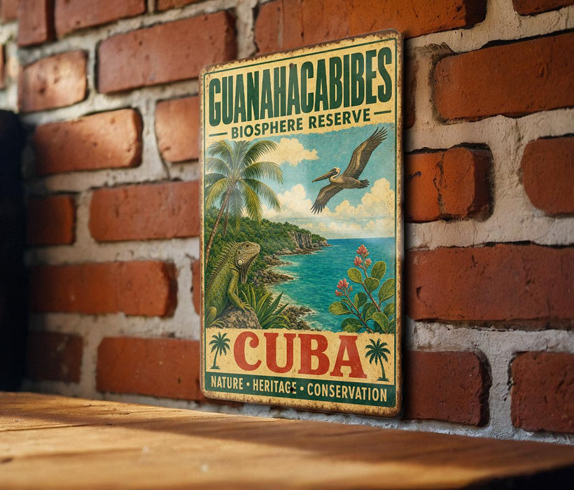 A vintage-style sign for the Guianacabibles Biosphere Reserve in Cuba, featuring a tropical landscape with palm trees, a bird, and a body of water.