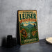 A vintage-style metal sign with text and illustrations of an orangutan, tiger, and other wildlife, advertising the Gunung Leuser Biosphere Reserve in Indonesia.