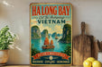A vintage-style metal sign advertising Halong Bay, Cat Ba Archipelago, and Vietnam, featuring a scenic image of boats sailing on the bay.