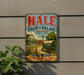 A vintage metal sign for Hale Farm and Village, featuring an illustration of a farm scene with a wagon and a windmill.